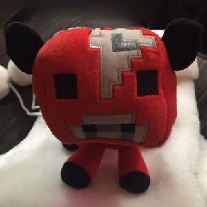 Red Plush Toy with Black Accents